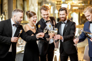 Group,Of,Elegant,People,Well-dressed,In,Retro,Styles,Celebrating,New - The Doomed Groom - The Doomed Groom Black Tie Wedding Attire Men